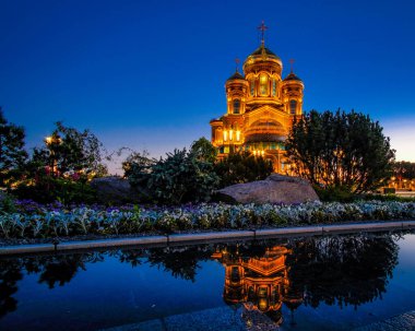 Night view of the main Orthodox church of the Russian Armed Forces after sunset. clipart