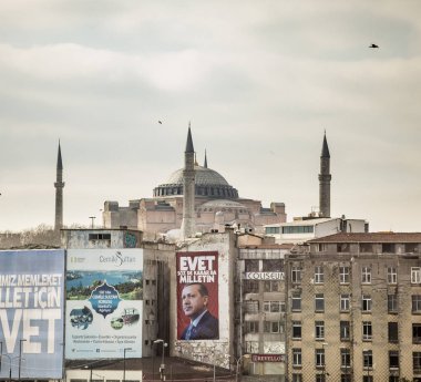 ISTANBUL, TURKEY-APRIL 1, 2017: political poster for President Recep Tayyip Erdoan decorates a wall clipart