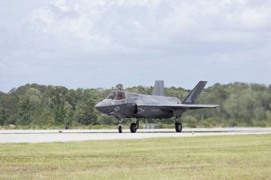 F-35 Lighning taxiing on tarmac clipart