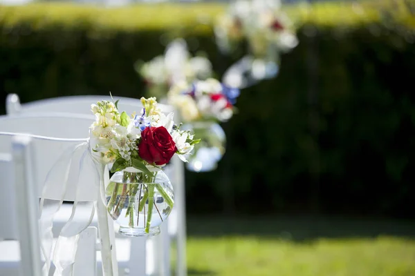 Bouquet of flowers in hanging jar for wedding