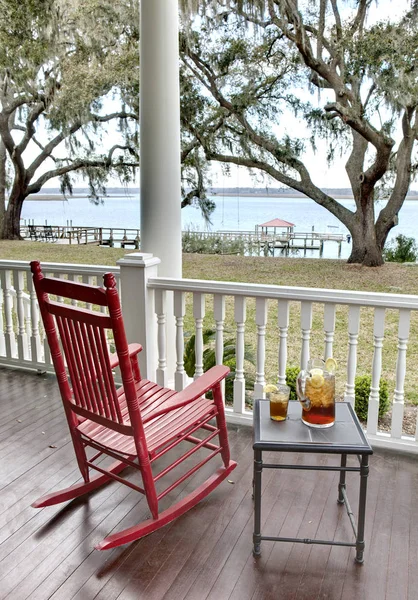 Red Rocking Chair Table Iced Tea Waterfront View — Stock Photo, Image