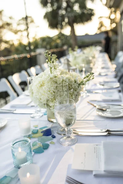 Table set up for outdoor sunset wedding reception