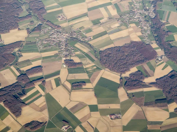 aerial view of patchwork of farms and village in Alsace Lorraine, France