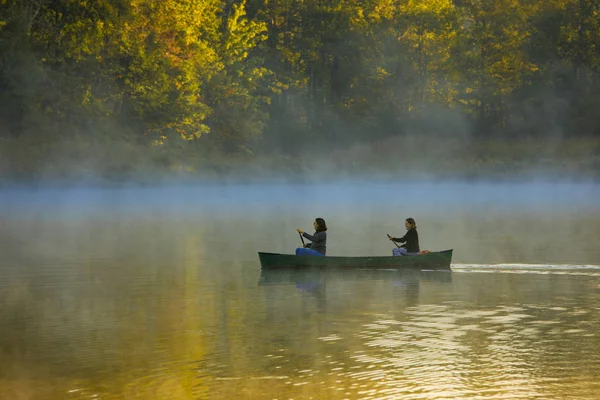 stock image mother and daughter canoeing in autumn colors