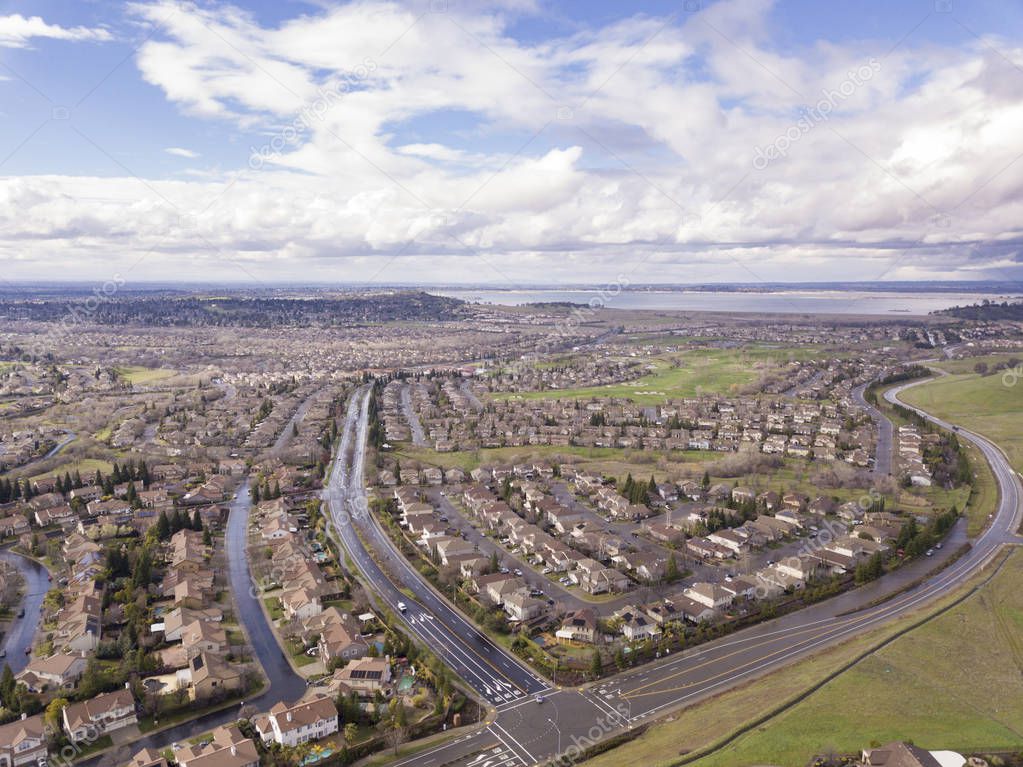 Aerial shot of Folsom, California with Folsom Lake in background.