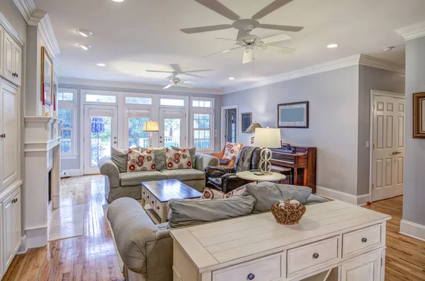 Expensive, well decorated living room with view windows.