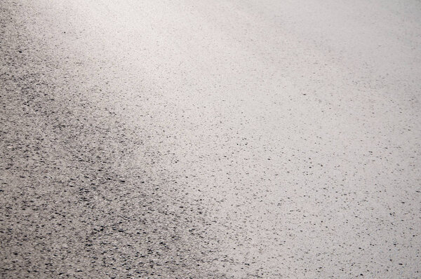 gray asphalt on a summer day. The road to the city.