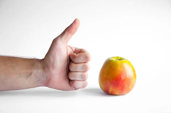 Apple Stands White Table White Background Hand Thumb Apple — Stock Photo, Image