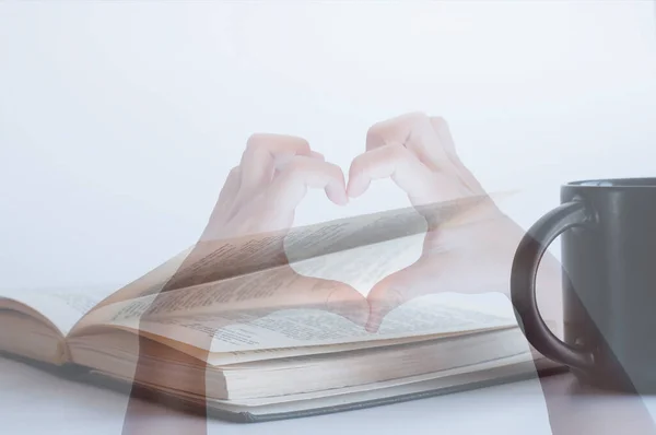 Open book Bible. The cup is on the table. Bible book love concept