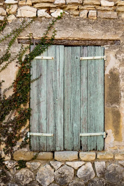 stock image old wooden faded green window