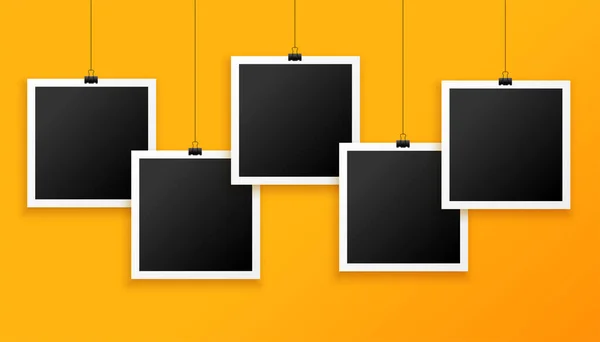 Five Hanging Photo Frames Yellow Background — Stock Vector