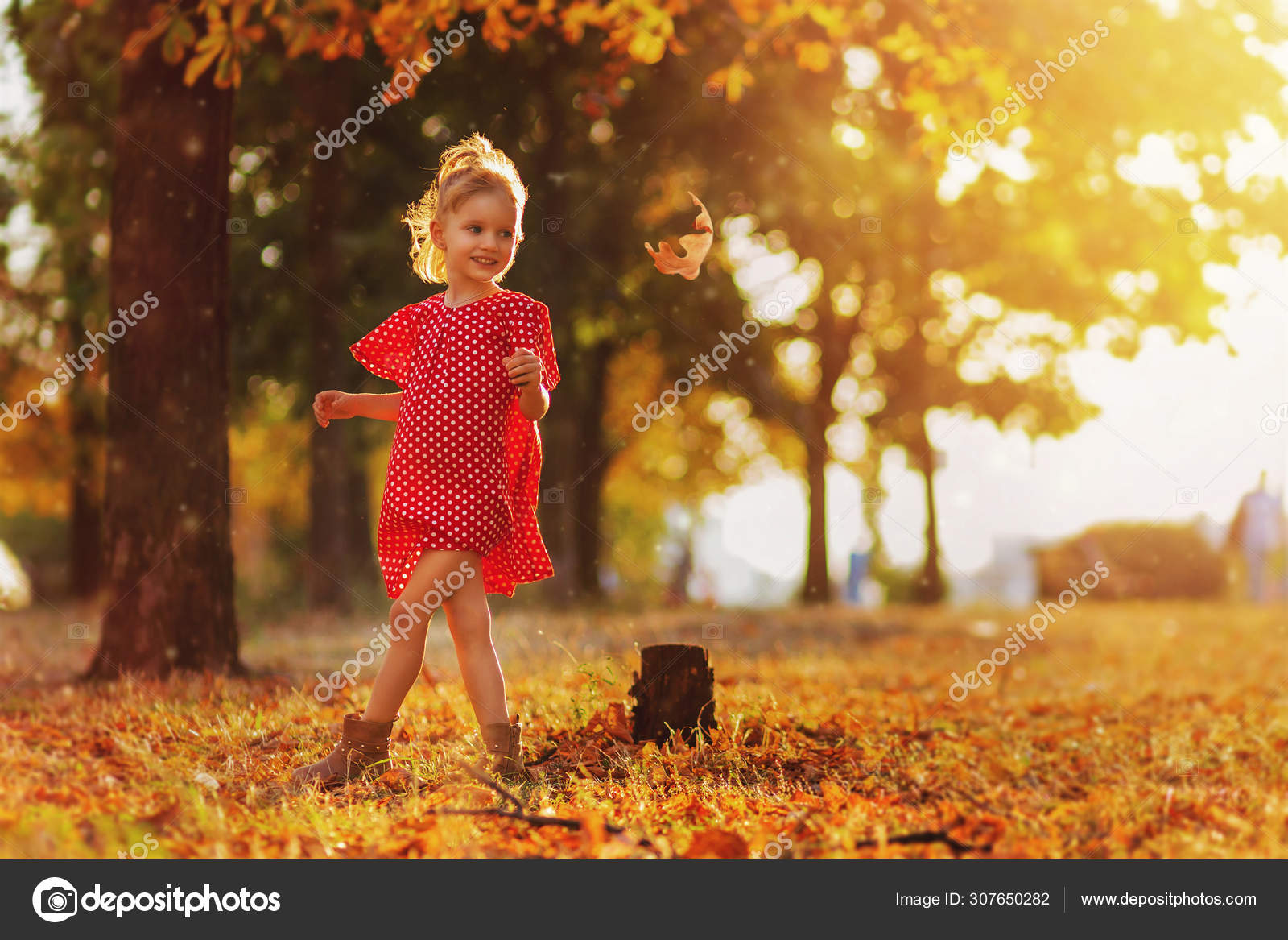 Journey In Nature Adorable Happy Girl Throwing The Fallen Leaves