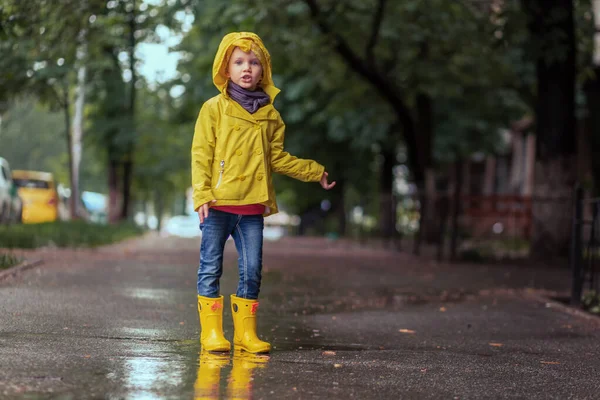 Sad Child Girl Yellow Raincoat Rubber Boots Puddle Parking Autumn — Stock Photo, Image