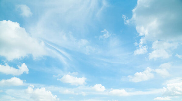 Blue sky with white clouds in daylight. /background/ copy space