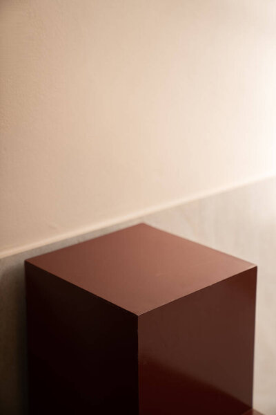 Empty red podium display on yellow background with shadow red rectangle stand concept. Blank product shelf standing backdrop.