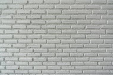 Duvar cephesinde / arka planda yüksek çözünürlüklü beyaz tuğla dokusu
