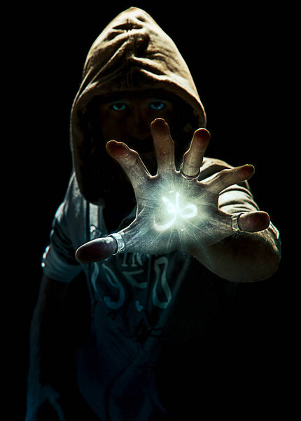 photo manipulation of a magic spell's wizard with six fingers