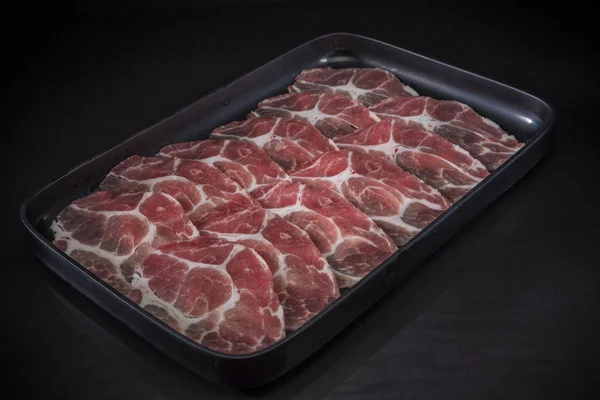 Thin sliced beef for Shabu Shabu, Sliced Wagyu Beef, shabu shabu, sukiyaki, raw food on black background