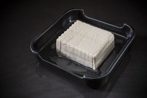 Japanese Tofu, Japanese soft cold tofu, healthy Japanese food, Asian food ingredeint, Block of Fresh Tofu on black background