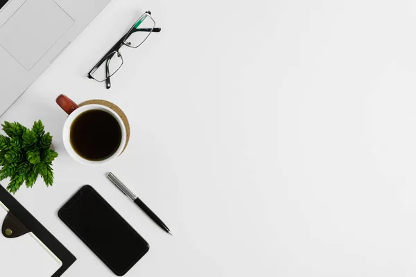 Work space from top view on white background. Minimal simplicity flat lay with copy space.