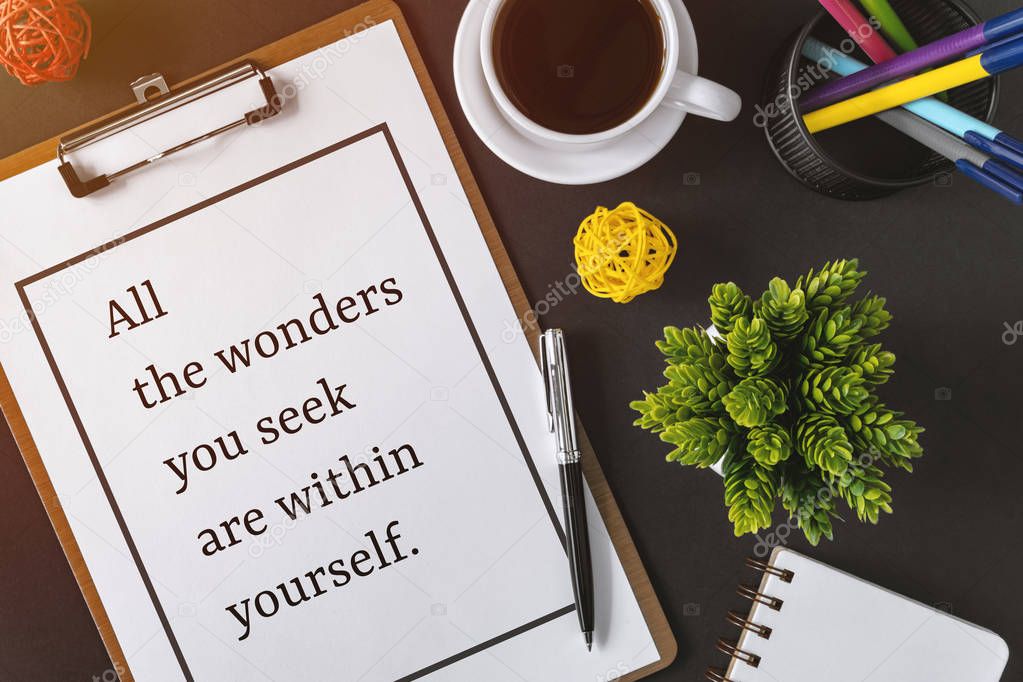 Inspirational and motivation life quote on clipboard with paper - All the wonders you seek are within yourself.