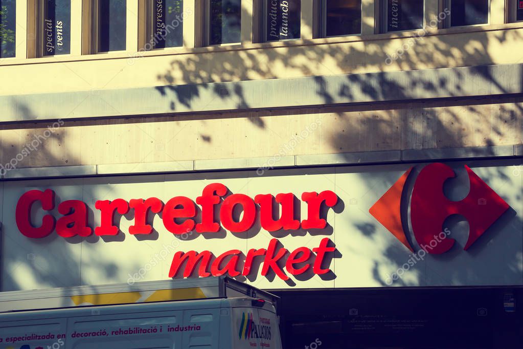 BARCELONA, SPAIN - APRIL 27, 2018: Carrefour supermarket in Barcelona in Spain on a Sunny day on the Rambla street