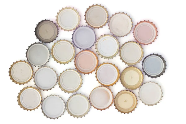 top view of arranged beer caps isolated on white background