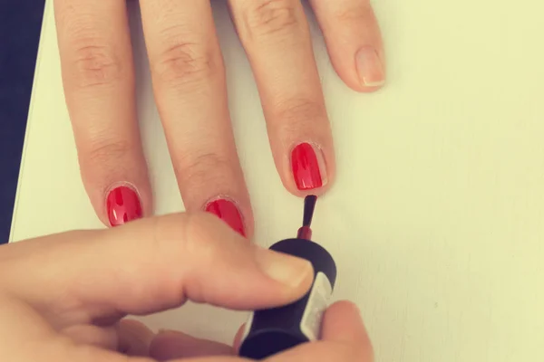 Putting Red Varnish Nails Hand — Stock Photo, Image