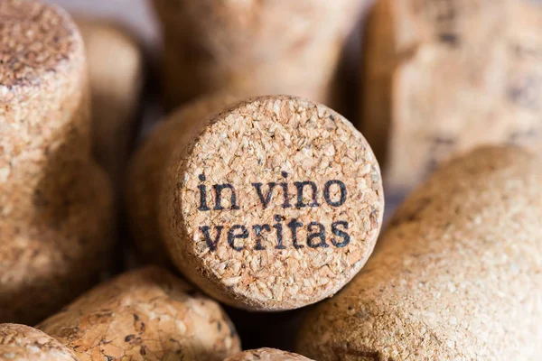 The cork from the wine with the words in vino veritas by laser, translated from Latin the truth in wine