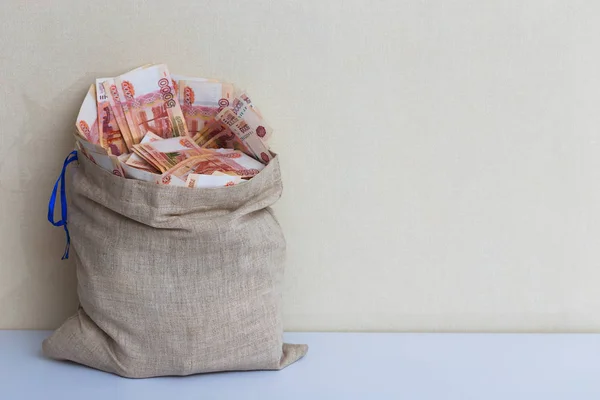 Canvas bag with five thousand banknotes