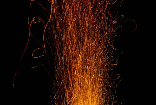 Abstract drawing of sparks from a fire in the dark sky