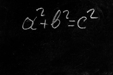 Pythagorean theorem on a black chalk Board clipart