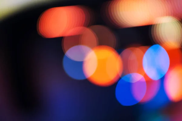 Multi-colored lights on blurred background with bokeh effect
