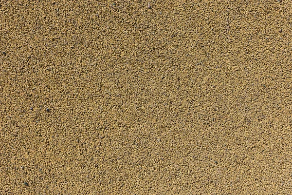 Textured background from molded crumb rubber for road paving