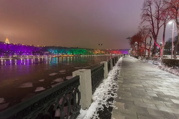 Luzhnetskaya embankment in winter with lights on, Russia, Moscow