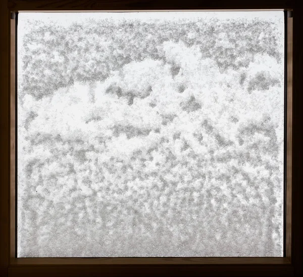 Abstract pattern, snow on window glass