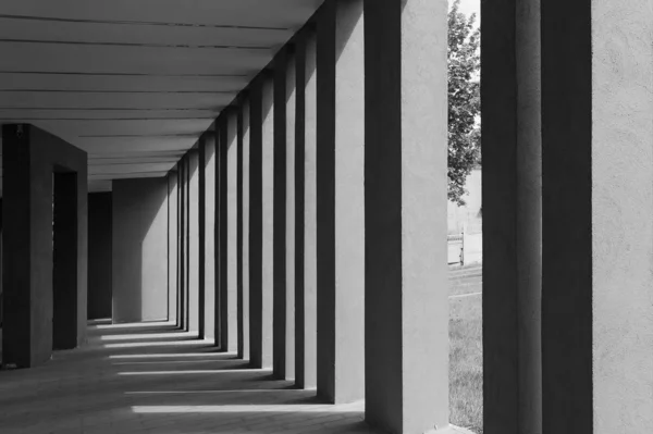 Modern columns in front of the building on a Sunny day