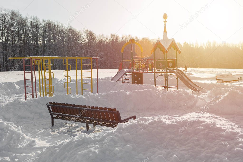 Beautiful Playground and sports equipment in the sunlight in the winter in the meadow