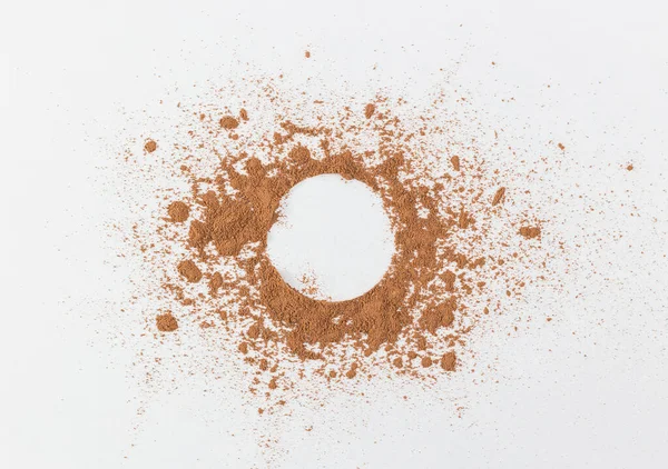 the simple frame of the free space inside a chaotic powder, abstract background of cocoa, paper the simple frame of the free space inside a chaotic powder, abstract background of cocoa, paper round