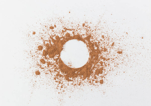 the simple frame of the free space inside a chaotic powder, abstract background of cocoa, paper the simple frame of the free space inside a chaotic powder, abstract background of cocoa, paper round