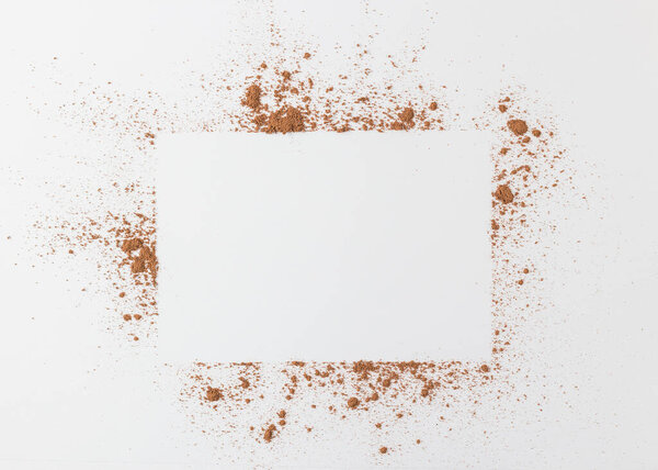 the simple frame of the free space inside a chaotic powder, abstract background of cocoa, paper the simple frame of the free space inside a chaotic powder, abstract background of cocoa, paper rectangle