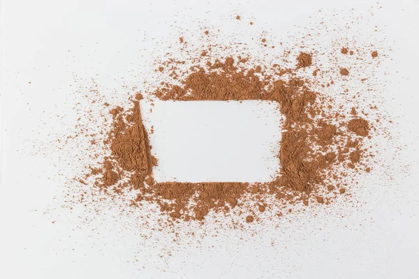 the simple frame of the free space inside a chaotic powder, abstract background of cocoa, paper the simple frame of the free space inside a chaotic powder, abstract background of cocoa, paper rectangle