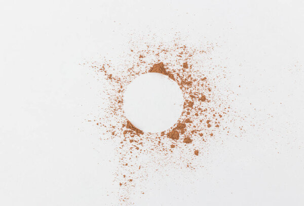 the simple frame of the free space inside a chaotic powder, abstract background of cocoa, paper the simple frame of the free space inside a chaotic powder, abstract background of cocoa, paper round