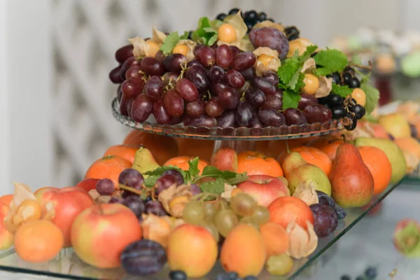 Catering service, fruits and berries on a stand close up