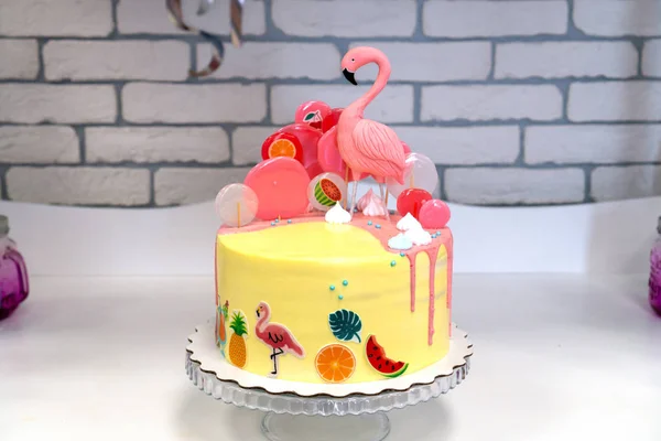 Flamingo cake at the Hawaiian party. Childrens birthday cake at