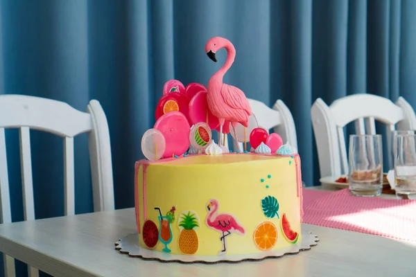 Flamingo cake at the Hawaiian party. Childrens birthday cake aon