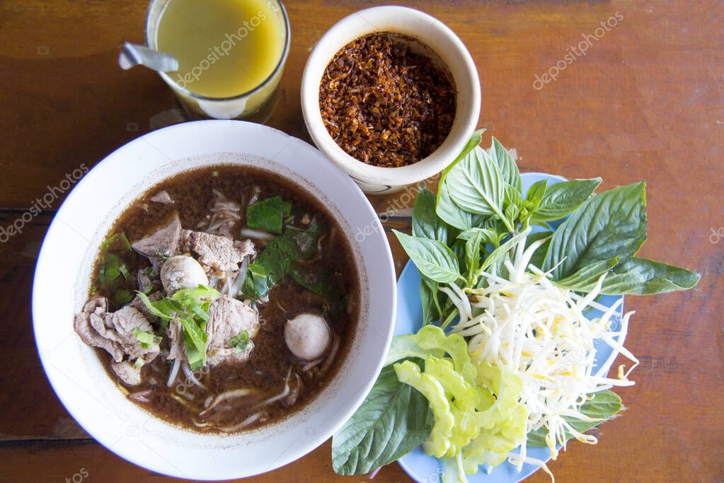 Boat  noodles,Thai style noodle soup or noodles with pork and pork balls, Ayutthaya Boat Noodle, Pork noodles mixed with pig's blood and Thai   Local food in Thailand that can be eaten in general is delicious and cheap.