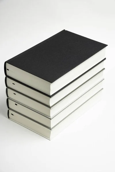 A Set Of Neatly Stacked Monochromatic Cloth Bound Books — Stock Photo, Image