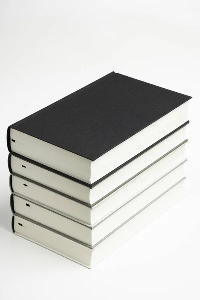 A Set Of Neatly Stacked Monochromatic Cloth Bound Books — Stock Photo, Image