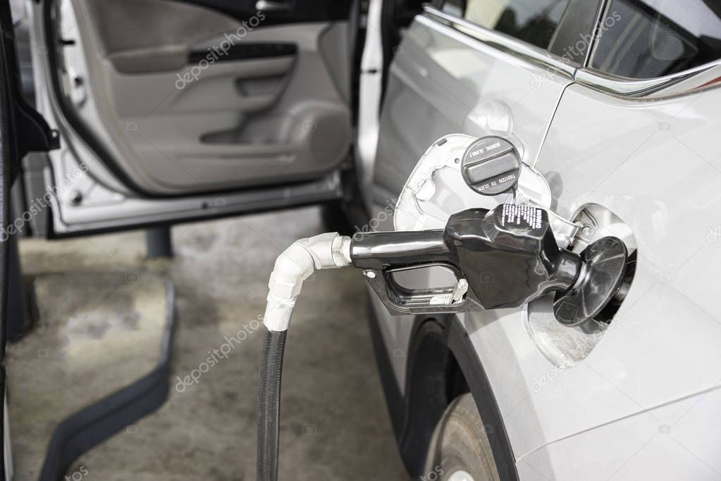 Filling A Vehicle���s Fuel Tank At A Gas Station
